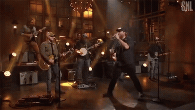 Group Of Men Playing Instruments On SNL Stage GIF