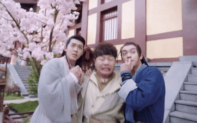 Group Of Men Posing In Front Of Building GIF