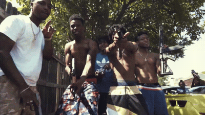 Group Of Men Posing One In Blue Adidas Shirt GIF