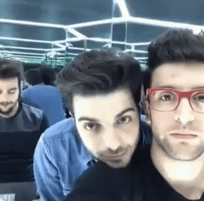 Group Of Men Posing One Wearing Glasses GIF