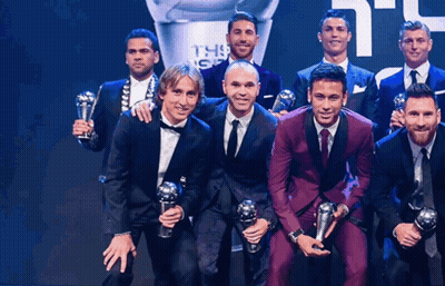 Group Of Men Posing With Trophies In Front Of FIFA Trophy GIF