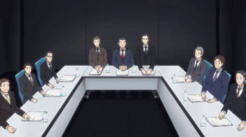 Group Of Men Sitting Around Long Table GIF