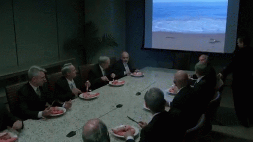 Group Of Men Sitting Around Table Eating Food GIF