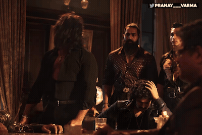 Group Of Men Sitting Around Table With Pranay Varma Watermark GIF