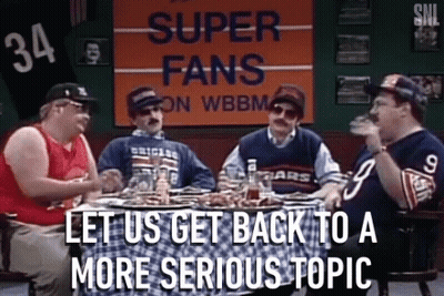 Group Of Men Sitting Around Table With Super Fans Sign GIF
