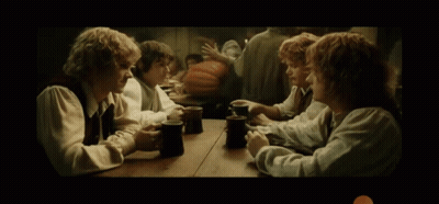 Group Of Men Sitting At Table With Mugs GIF