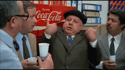 Group Of Men Sitting By Coca Cola Ad GIF