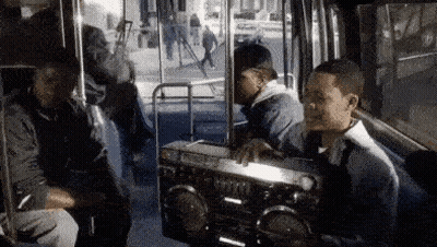 Group Of Men Sitting On Bus With Boombox GIF