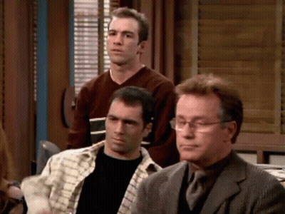 Group Of Men Sitting One With Glasses GIF