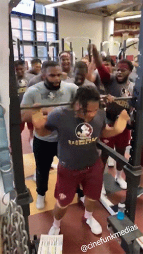 Group Of Men Squatting In Gym With Florida State Shirt GIF