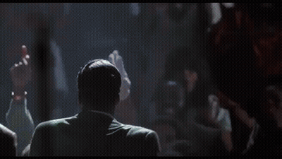 Group Of Men Standing Around Microphone GIF