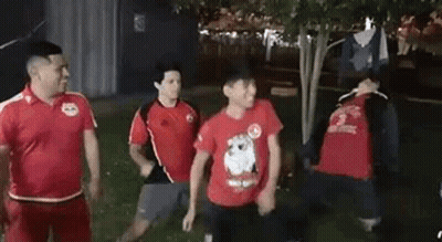 Group Of Men Standing In A Park GIF
