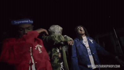 Group Of Men Standing In Dark GIF