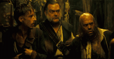 Group Of Men Standing In Dark Room GIF