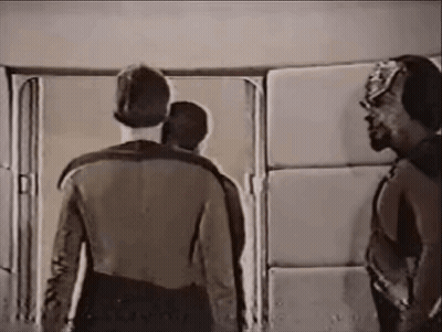 Group Of Men Standing In Front Of Door GIF