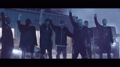 Group Of Men Standing In Line Hands Up GIF