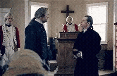 Group Of Men Standing In Room With Cross GIF