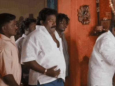 Group Of Men Standing In Room With TM Logo GIF