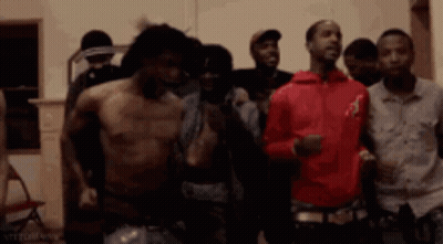 Group Of Men Standing Shirtless In Room GIF
