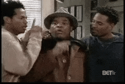 Group Of Men Standing Together One Wearing Hat GIF