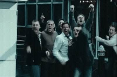 Group Of Men Standing With Arms In Air Screaming GIF