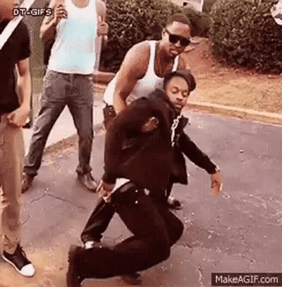 Group Of Men Watching Man Dancing On Street GIF