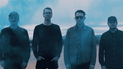 Group Of Men With Smoke Coming Out Of Pockets GIF