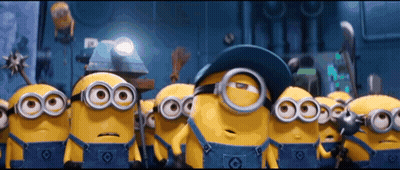 Group of Minions in Overalls and Goggles Standing in a Row