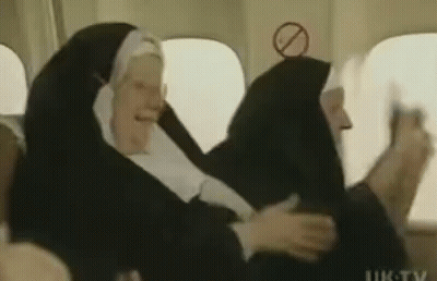 Group Of Nuns Sitting On Plane GIF