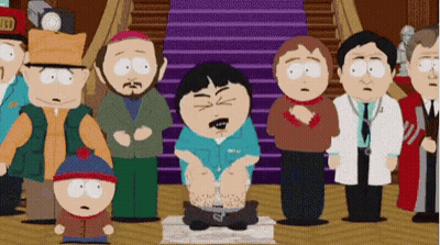 Group Of People Around Cartoon Sitting On Box GIF
