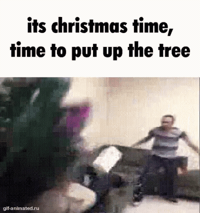 Group Of People Around Christmas Tree GIF