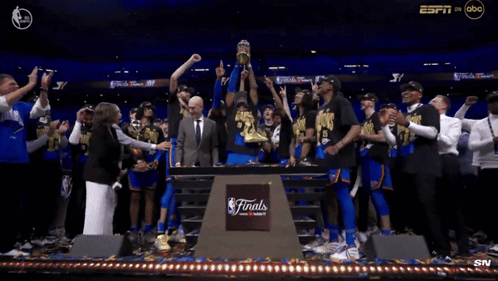 Group Of People Around Finals Podium GIF