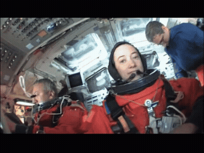 Group Of People Around Giant Inflatable Astronaut Balloon GIF