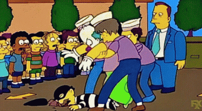 Group Of People Around Lying Man GIF