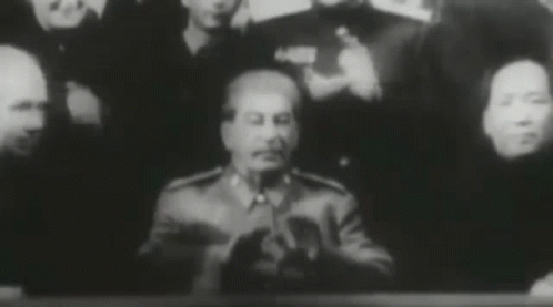 Group Of People Around Man In Military Uniform GIF
