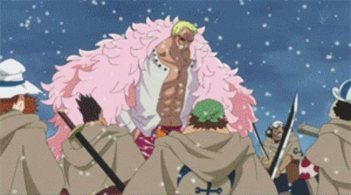 Group Of People Around Man In Pink Fur Coat GIF