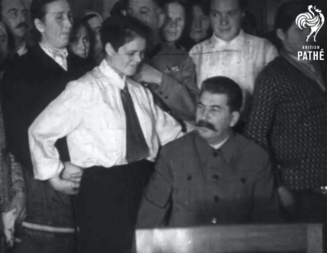 Group Of People Around Mustached Man GIF