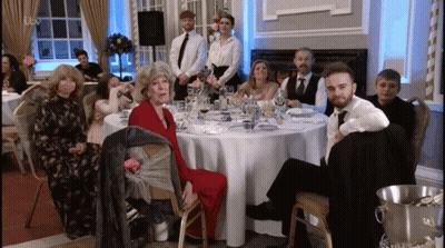 Group Of People At Table With Champagne GIF