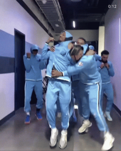 Group Of People Dancing In A Hallway GIF