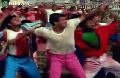 Group Of People Dancing In A Stadium Crowd GIF