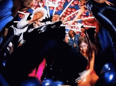Group Of People Dancing In Balloon And Heart Room GIF