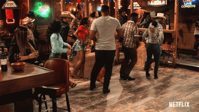 Group Of People Dancing In Bar With Netflix Logo GIF