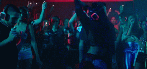 Group Of People Dancing In Club Wearing Masks GIF
