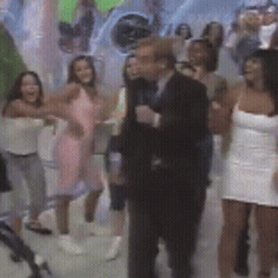 Group Of People Dancing In Front Of Cat Painting GIF