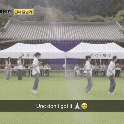 Group Of People Dancing In Front Of Ship Building GIF