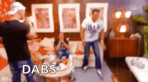 Group Of People Dancing In Living Room With Word Dabs GIF