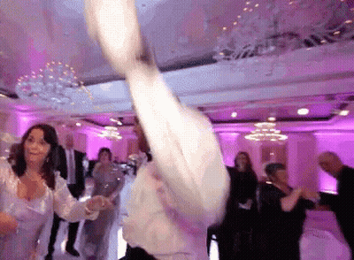 Group Of People Dancing In Pink Lights GIF