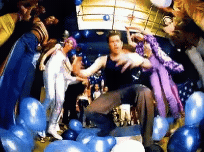 Group Of People Dancing In Room With Balloons GIF