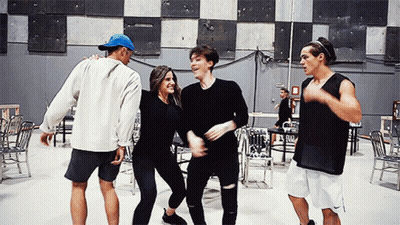 Group Of People Dancing In Room With Chairs GIF