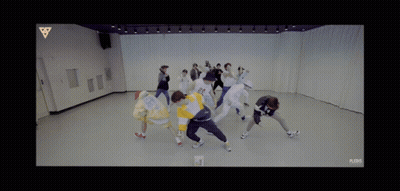 Group Of People Dancing In Room With Triangle GIF